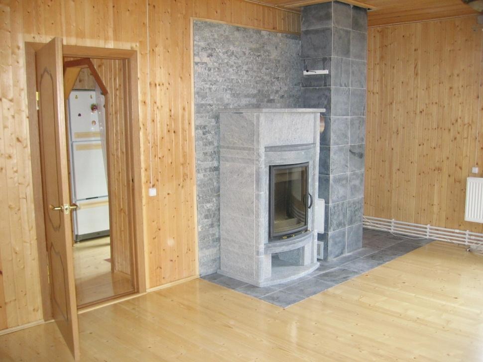 финишная облицовка негорючей теплоизоляционной стены за теплонакопительным камином 